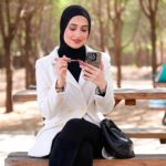 Model wearing black hijab in a park in Kuwait