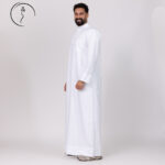Side view of a man in a white dishdasha
