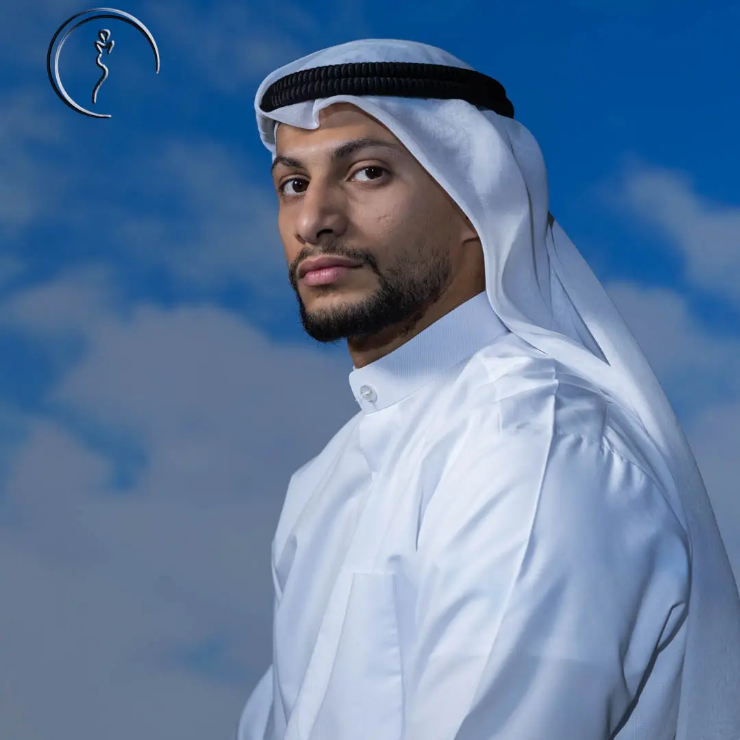 Kuwaiti male model in traditional white dishdasha and ghutra against blue sky backdrop