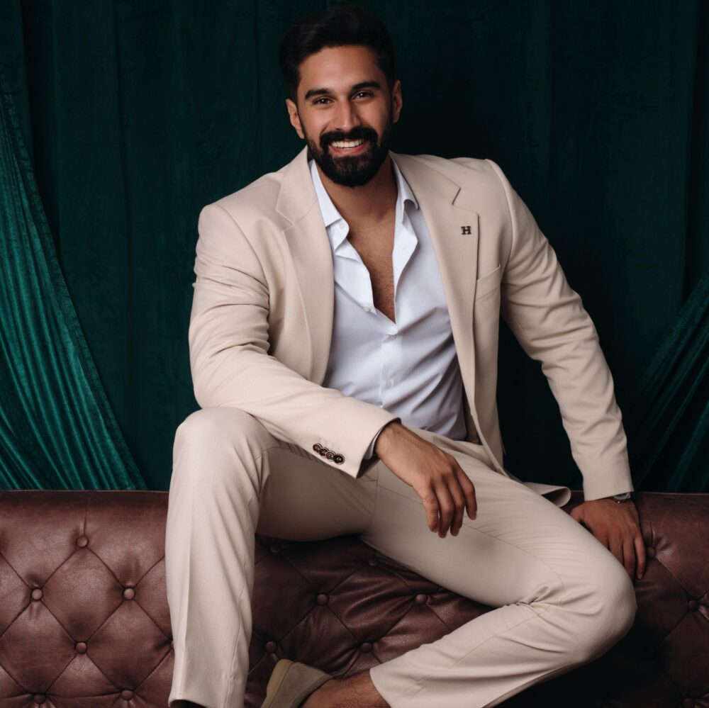 Man with beard in beige suit