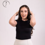 Happy woman touching her hair.