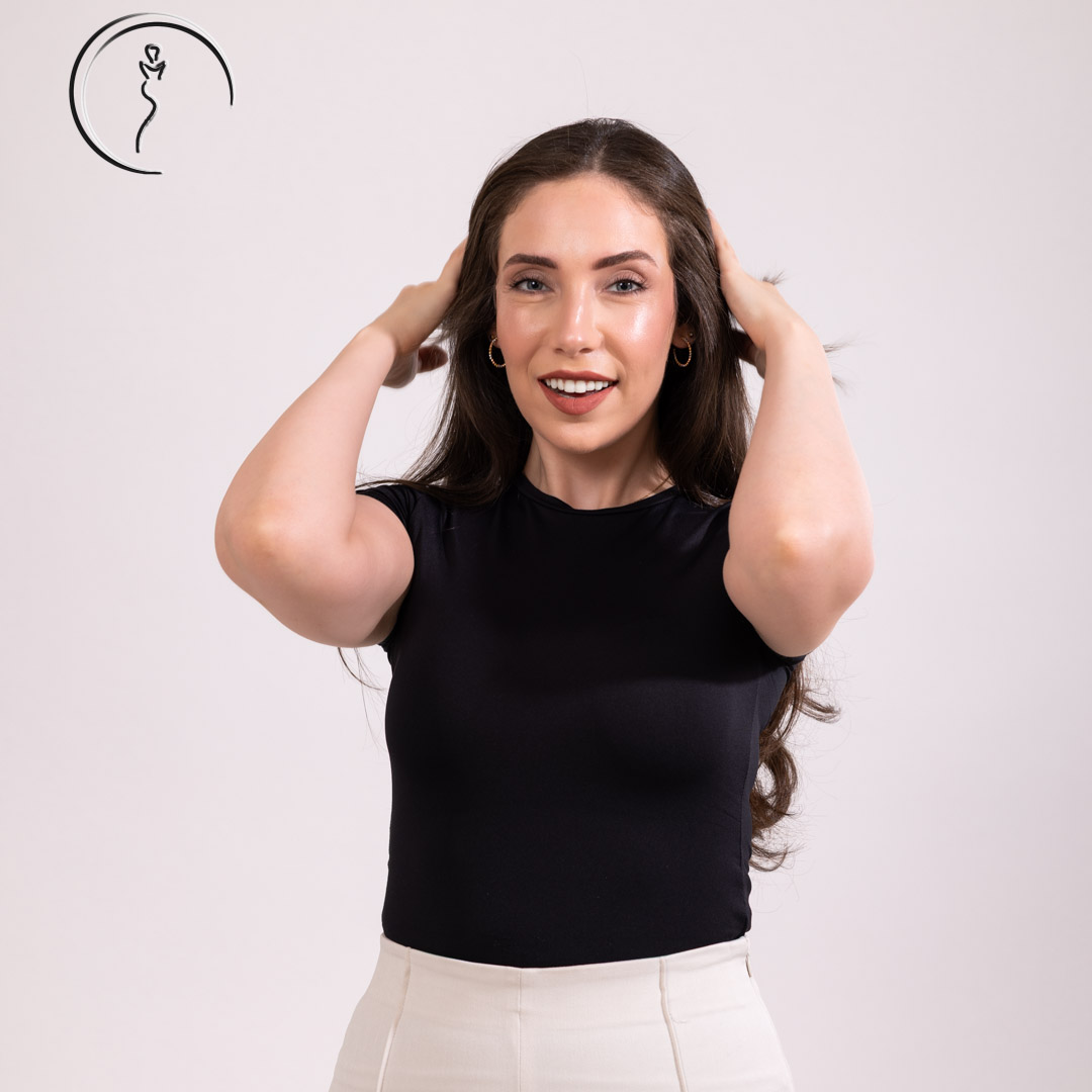 Happy woman touching her hair.