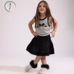 Young Kuwaiti girl posing confidently for kids fashion photoshoot