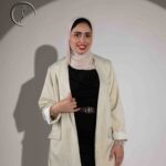 Fashion portrait of a Kuwaiti woman in hijab and flowing modest dress