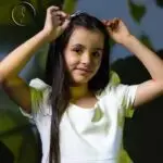 Girl in white dress with soft lighting and shadow