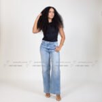 Smiling curly haired female model in Kuwait in brown top, beauty portrait – Model 689, Promodel Service