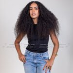 Curly haired model in Kuwait wearing a fitted brown midi dress, full-length studio shot – Model 689